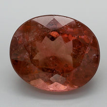 Load and play video in Gallery viewer, 8.19ct Pinkish Orange Oval Cut Pink Brazil Tourmaline, IGI Certified
